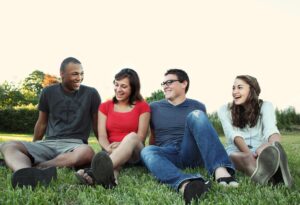 A group of friends sitting on the grass